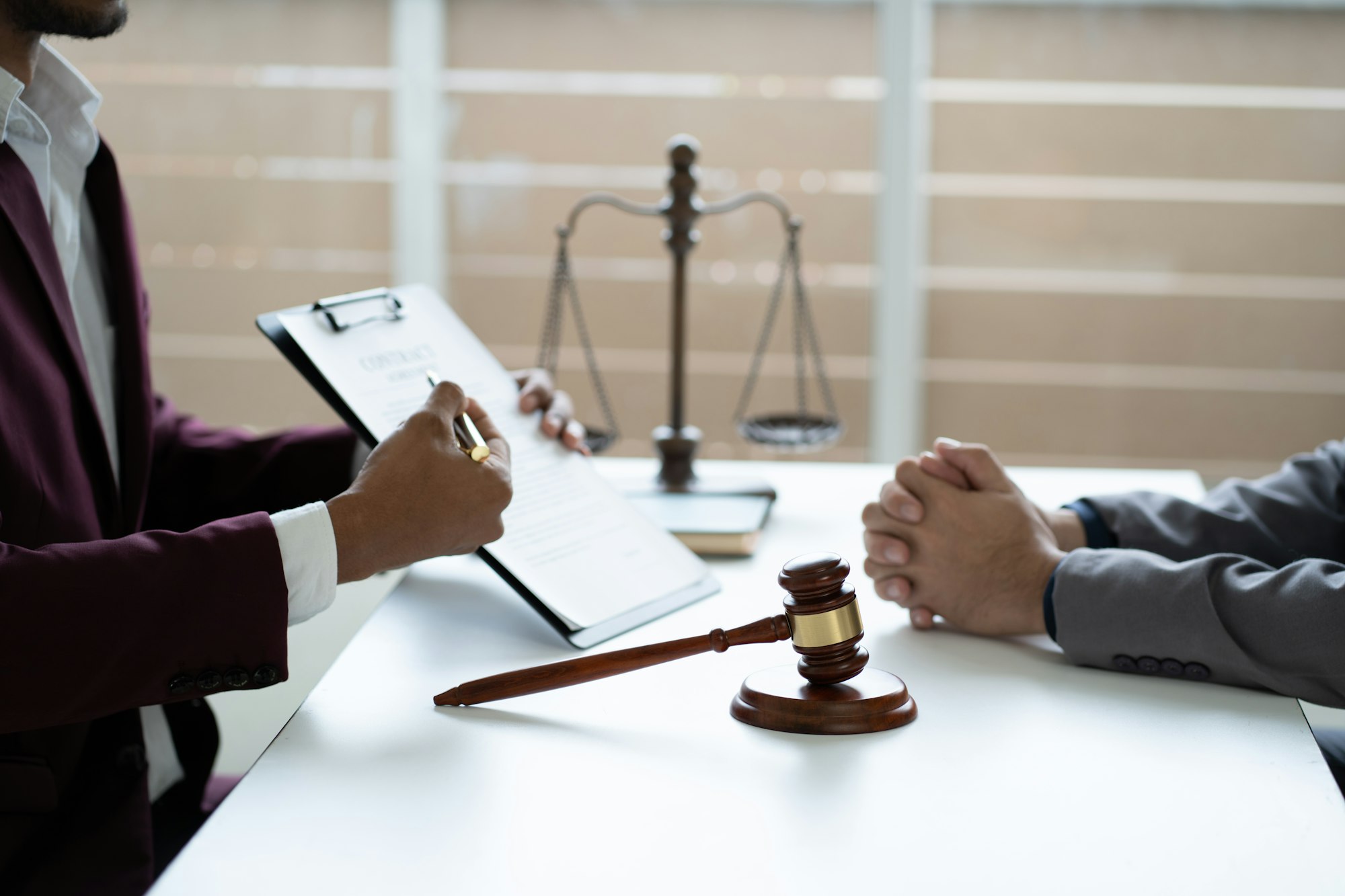 Professional lawyer reading agreement contract document and explaining legal agreement terms to